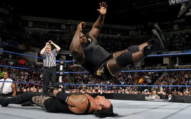 Image of Mark Henry jumping on undertaker